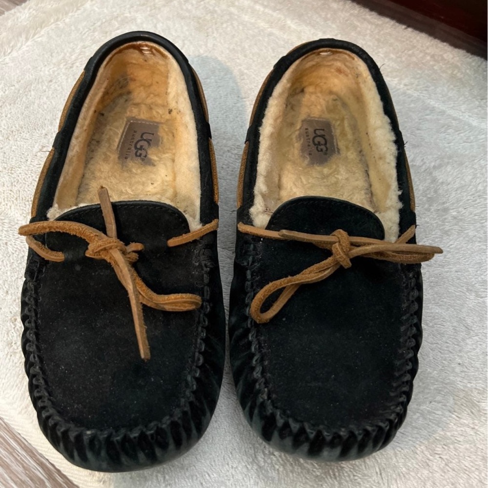 Black suede UGG slippers (moccasins) size 8. Have been worn. Minor flaws